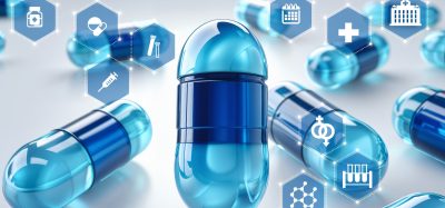 A close-up of blue pharmaceutical capsules surrounded by digital hexagon icons representing medical and laboratory technologies, symbolising modern drug discovery and data-driven research.