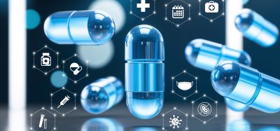 Futuristic blue medical capsules surrounded by hexagonal healthcare icons, symbolizing AI-driven drug discovery and advanced pharmaceutical development