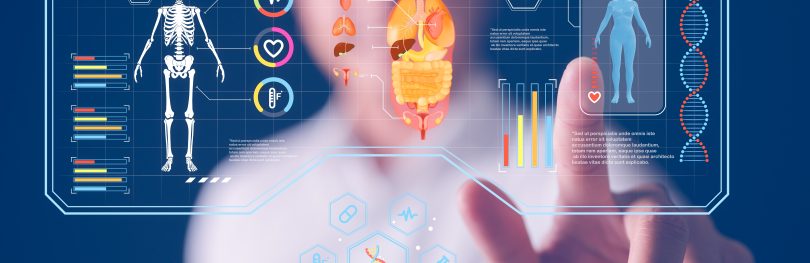 Doctor interacting with a futuristic digital medical interface showing human skeleton, organs, DNA strands, and health data visualisations, symbolising AI and precision medicine.