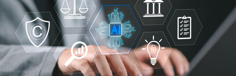 Person using a laptop with AI, legal, data analytics and compliance icons displayed, representing business development and strategic decision-making in drug discovery.