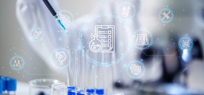 Scientist using a pipette to transfer blue liquid into test tubes, with digital workflow and data integration icons overlaid to represent AI-enabled laboratory systems.