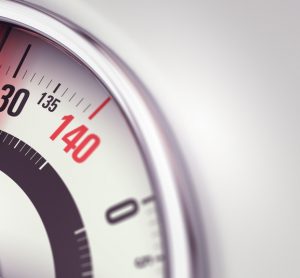 Bathroom scale indicating obesity