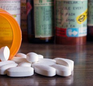 Pain relief tablets spilled out on table